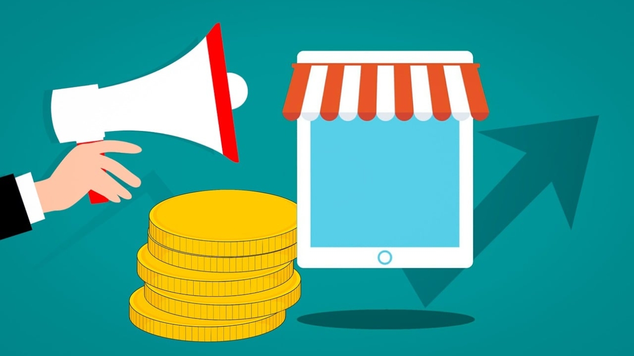 obraz przedstawiający megafon, monety i tablet